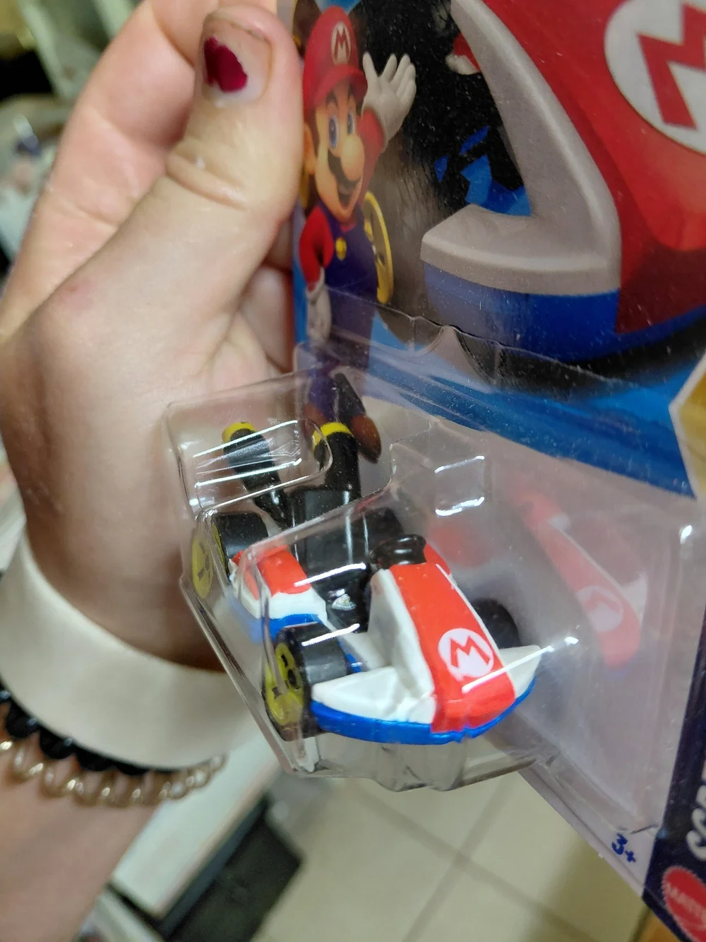 the Hot Wheels Mario Kart Standard Kart featuring Mario, part of the HW Screen T